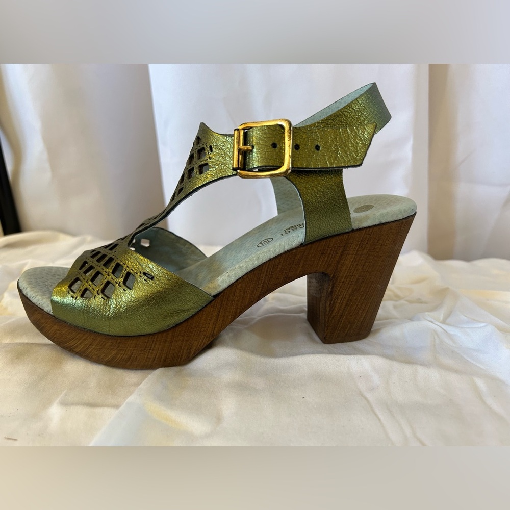 Green metallic chunky clog type sole sandal with cutouts and ankle strap